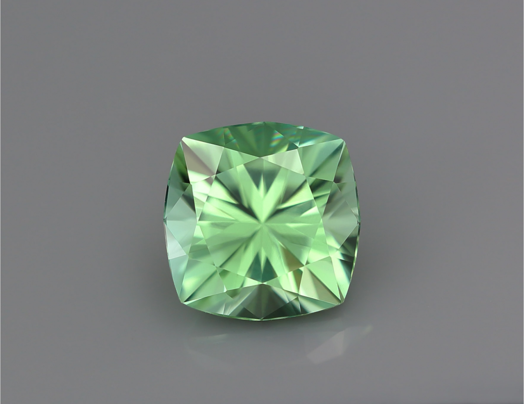 Precision cut 3,19 ct apple-green Tourmaline from D. R. Congo in cushion shape Precision cut 3,19 ct apple-green Tourmaline from D. R. Congo in cushion shape